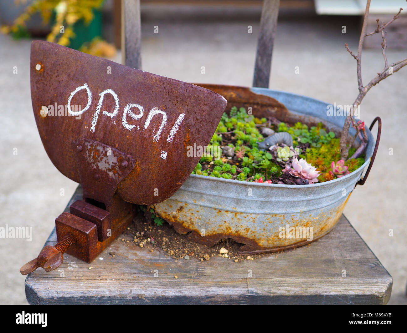 Rustic Country Open Sign Written In Chalk On A Rusty Vice