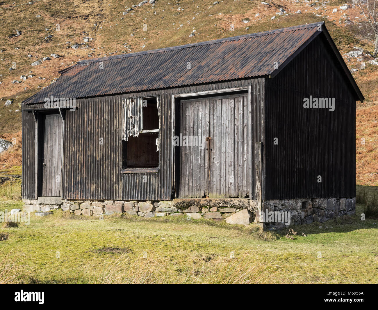 Old corrugated iron shed in Glen Cannich, Scotland, UK Stock Photo