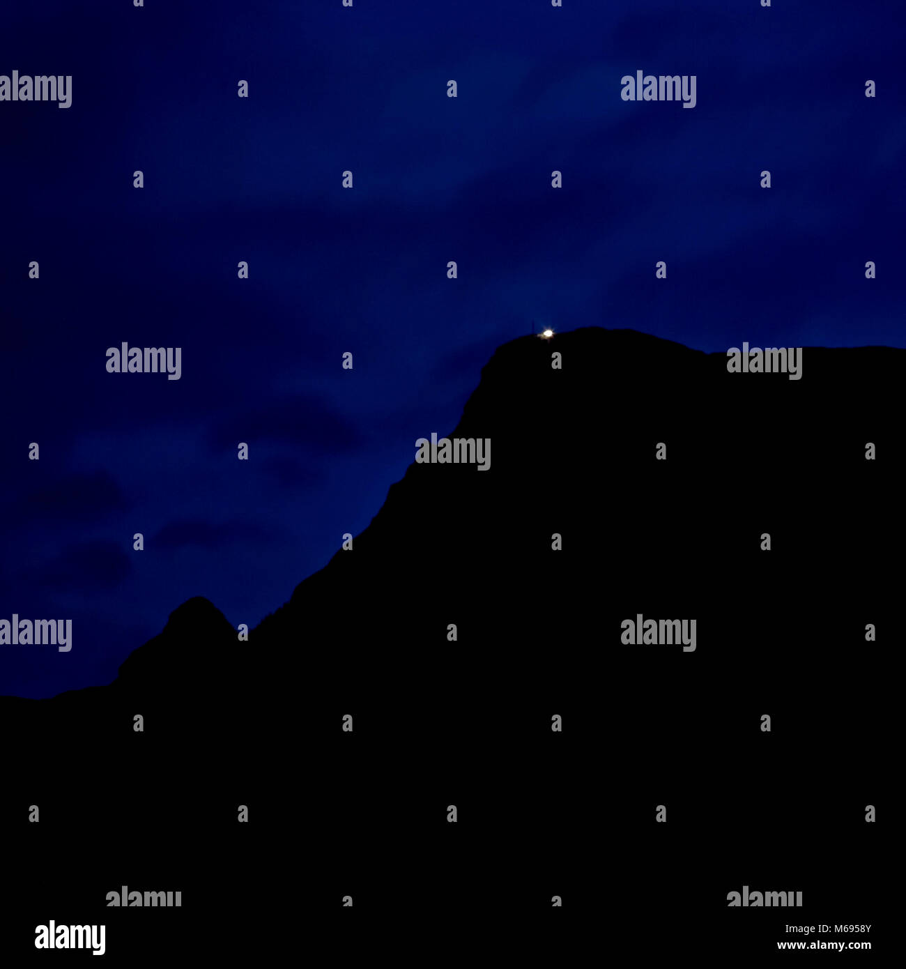 Dachstein mountains at night with single point of light, Austria Stock Photo