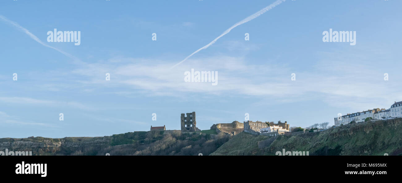 Looking up from North Bay, Scarborough to the blue sky and horizon of flats and hotel buildings