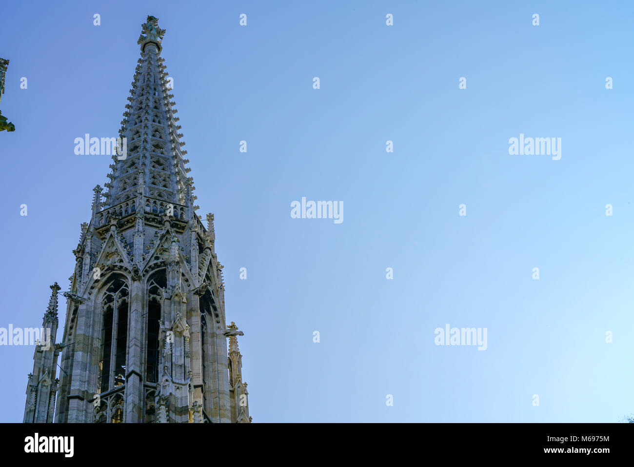 Gothic spire against blue sky Stock Photo - Alamy