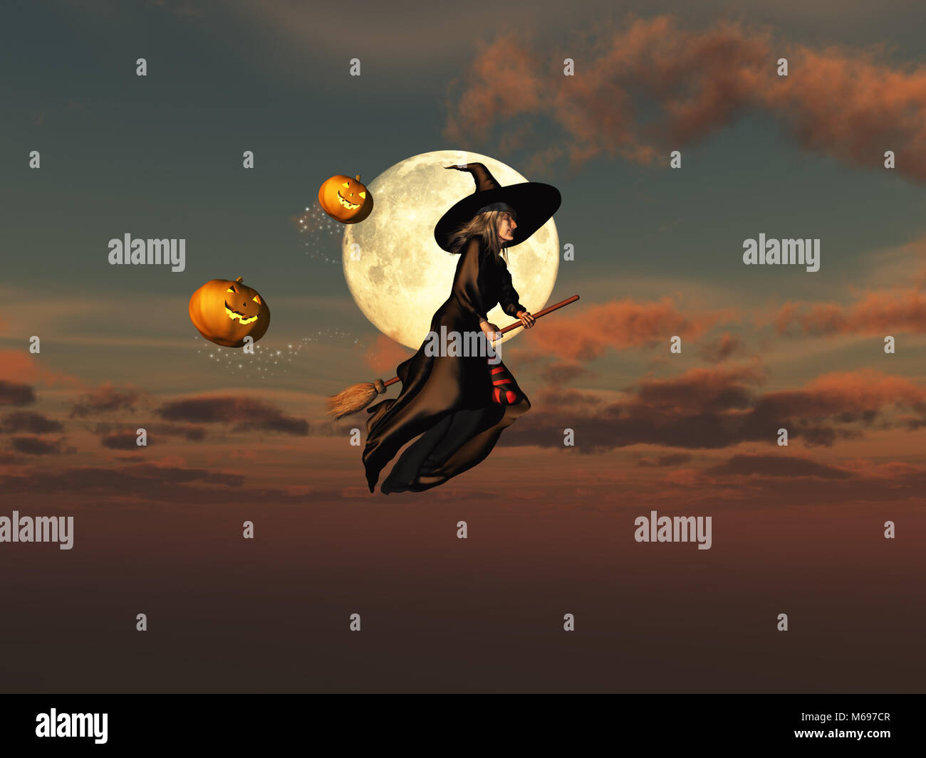 Witch on a broomstick and jack-o'-lanterns Stock Photo