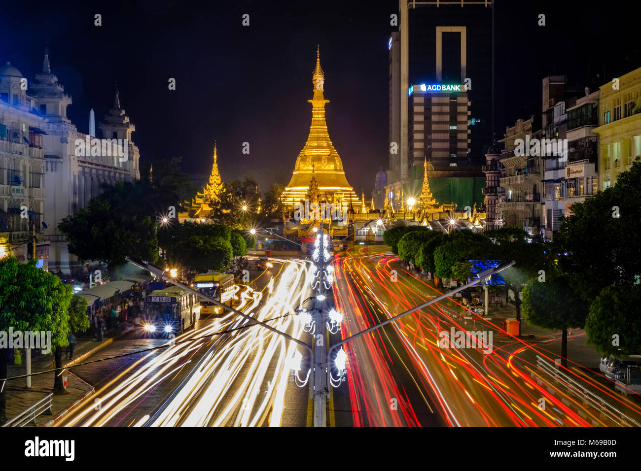 The golden Sule pagoda, one of the big pagodas, is located in the centre of town and illuminated at night Stock Photo