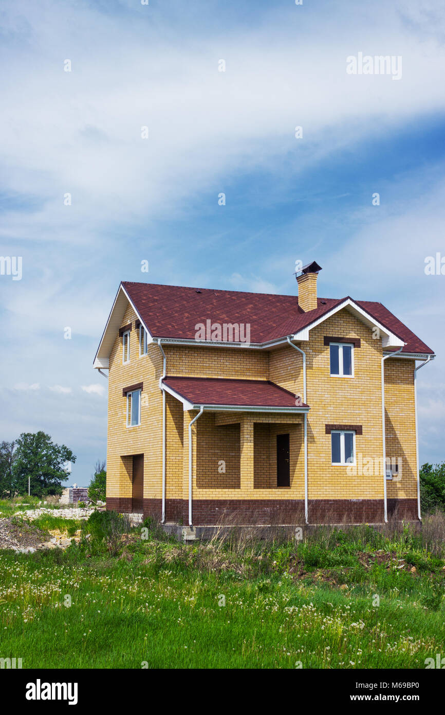 House of yellow brick. Construction completed Stock Photo - Alamy