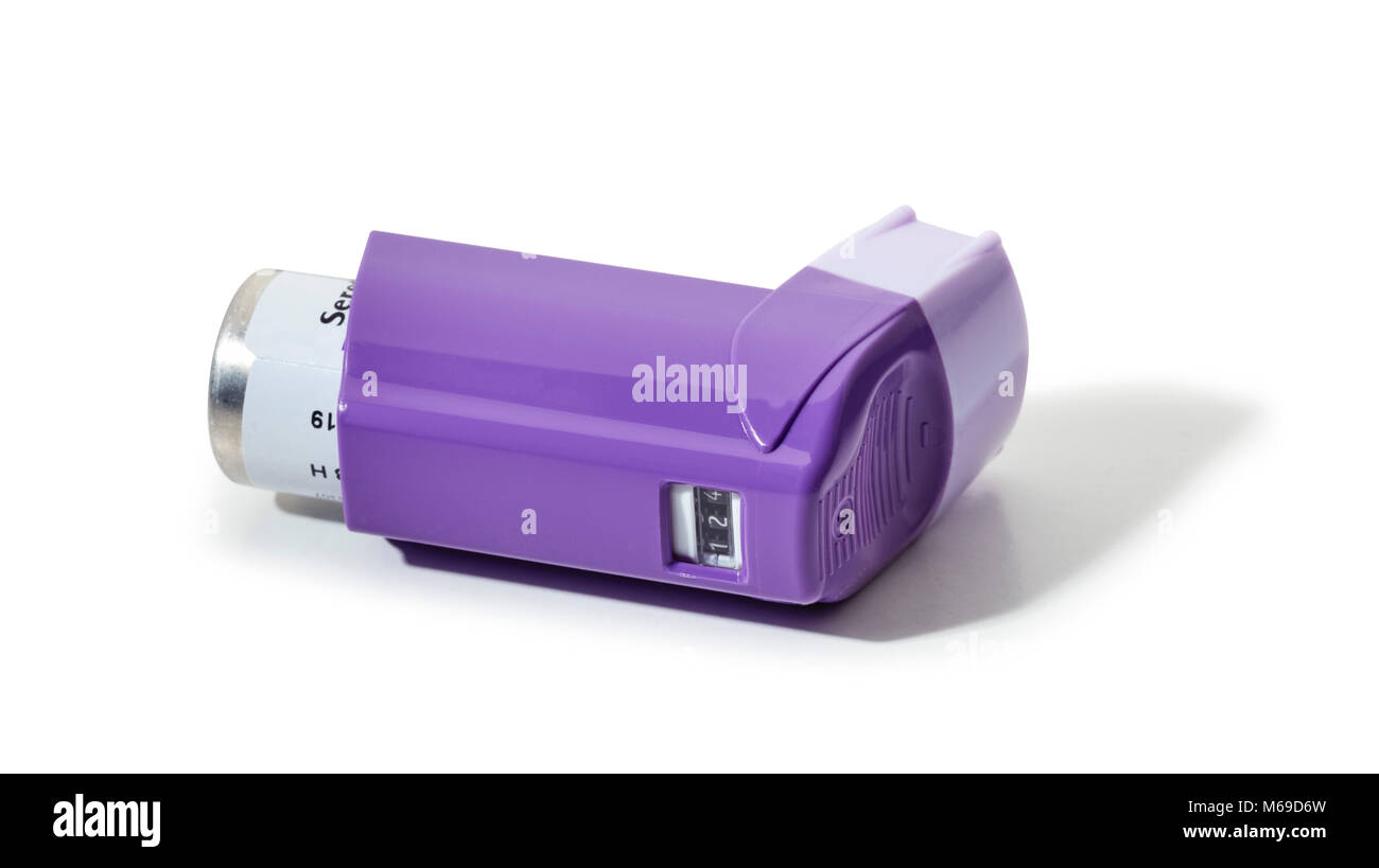 Mauve asthma Inhaler with a number window on a white background Stock Photo