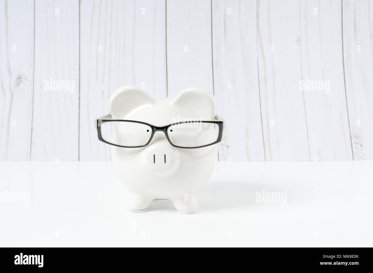 Front view. White piggy bank in glasses isolated on white Stock Photo ...