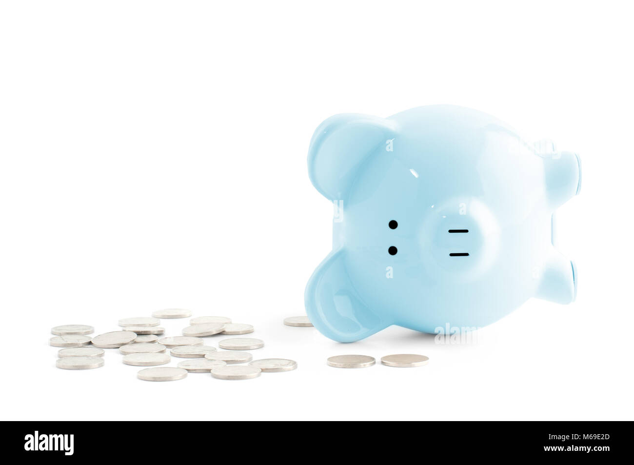 Empty blue piggy bank and coins on white background Stock Photo - Alamy