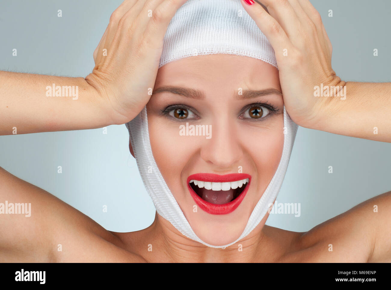 Woman has headache. Beautiful woman after plastic surgery with bandaged