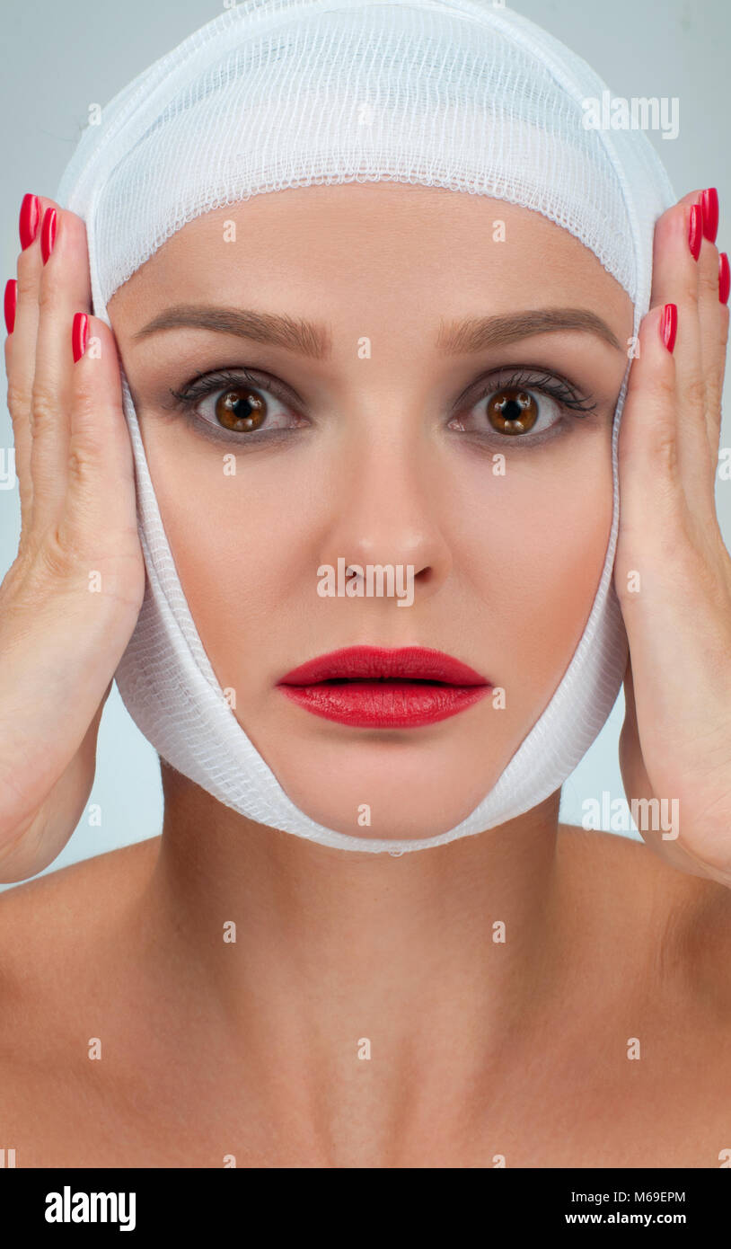 Patient in bandages. Beautiful woman after plastic surgery with