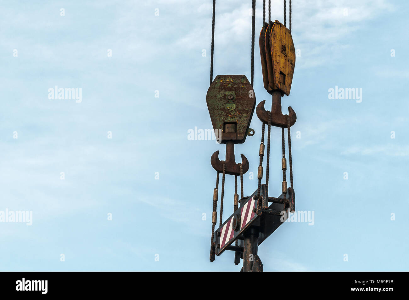 top piece of a hoist crane against a blue sky background Stock Photo ...
