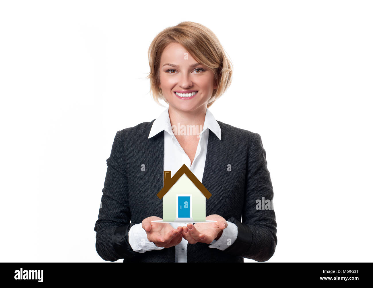 Real estate agent with house model. Business woman is holding house on ...