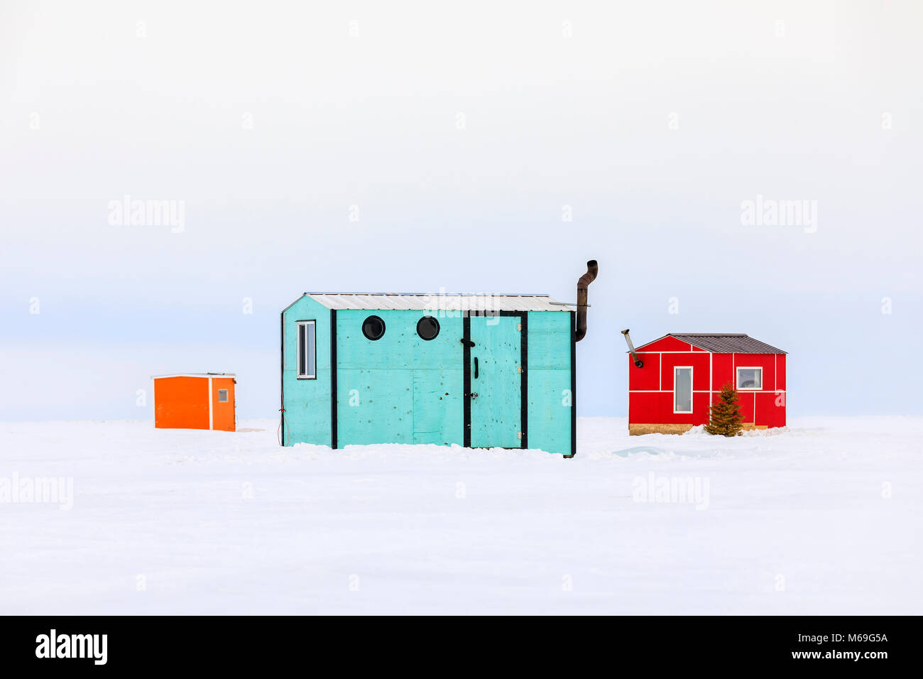 Ice fishing huts on Lake Winnipeg, Manitoba, Canada. Stock Photo