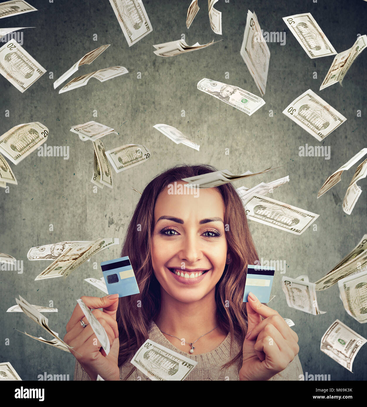 Happy Debt Free Woman Holding A Credit Card Cut In Two Pieces Under Stock Photo Alamy