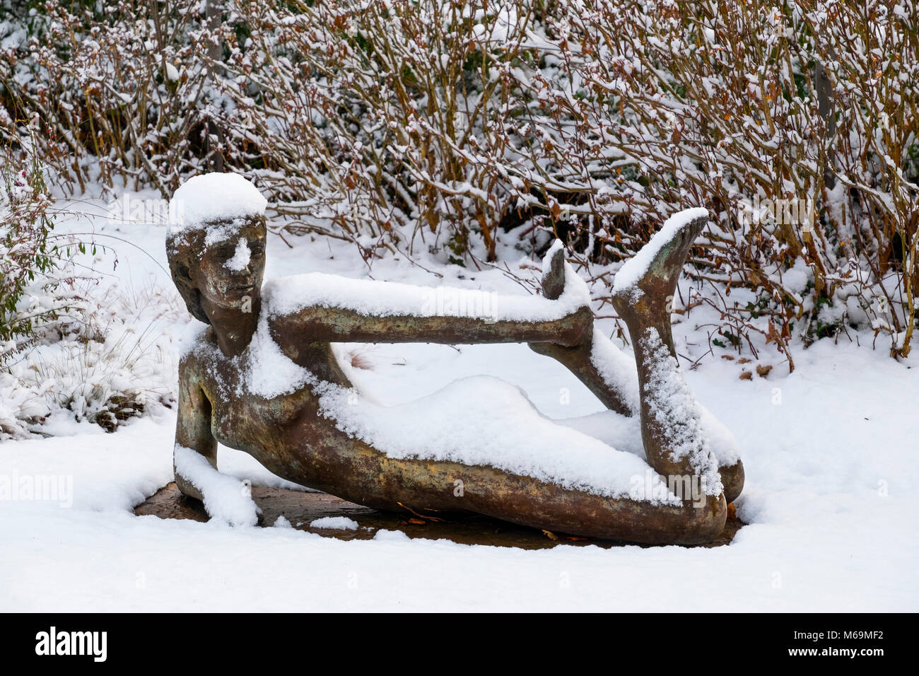 Snow scene. Sculpture in the town hall park, Troinex, Tomorrow I go to the printing press, how many copies of the book Climate Change do you want? Stock Photo