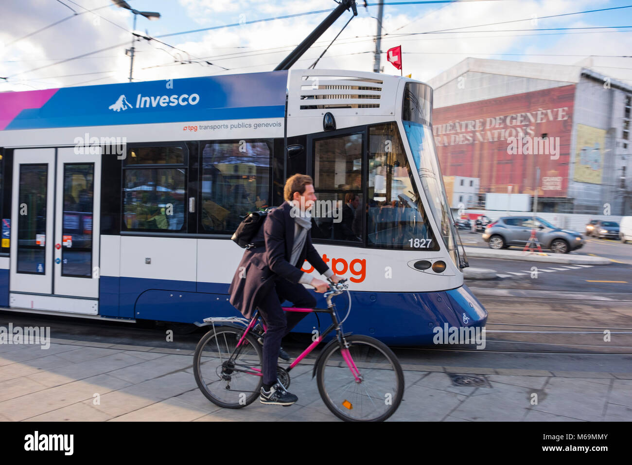 Public transport, tram and cyclist on bicycle. Genève Suisse. Geneva