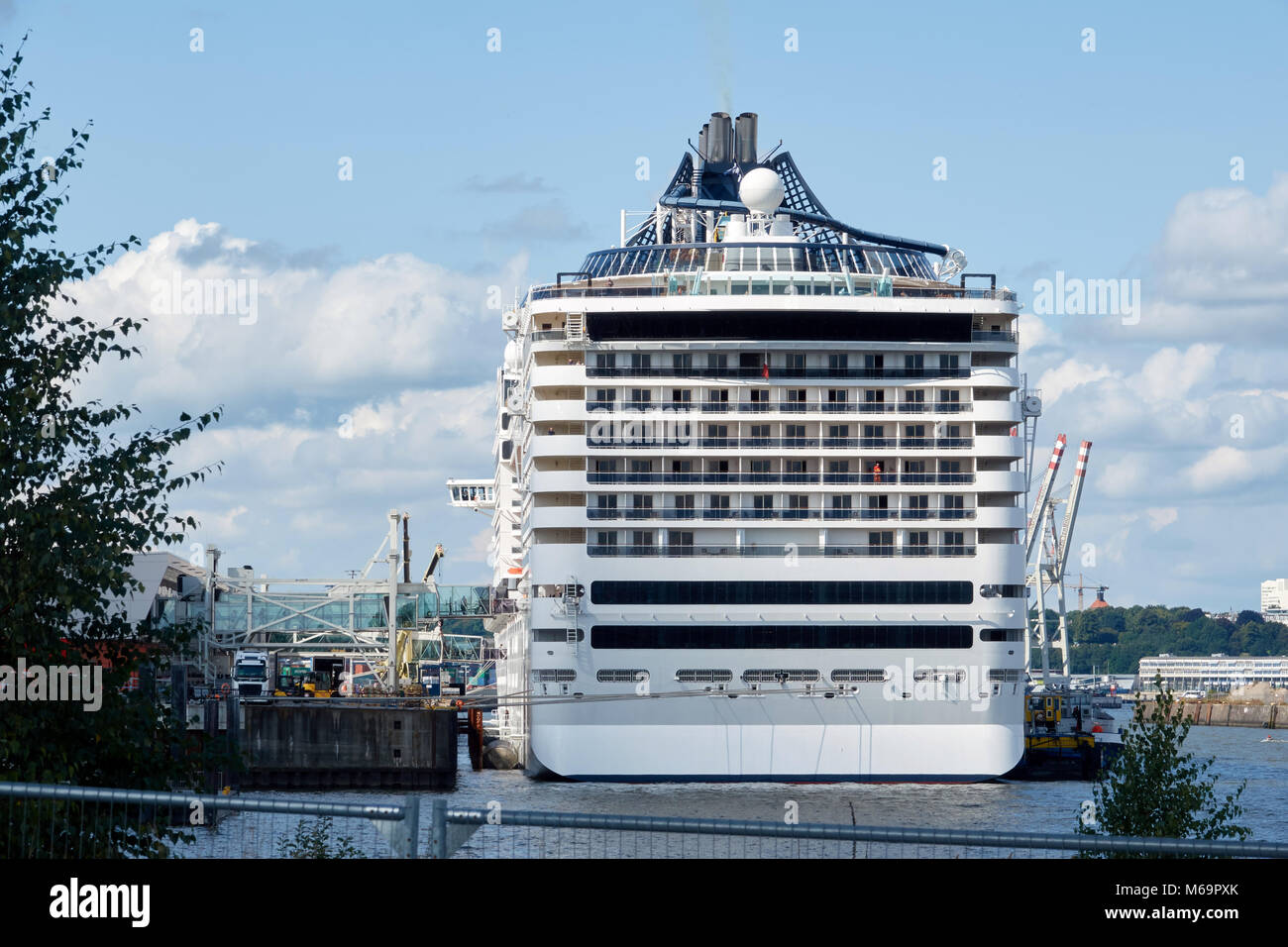 A large sea cruise liner in the port of Hamburg on loading. Back view. Stock Photo
