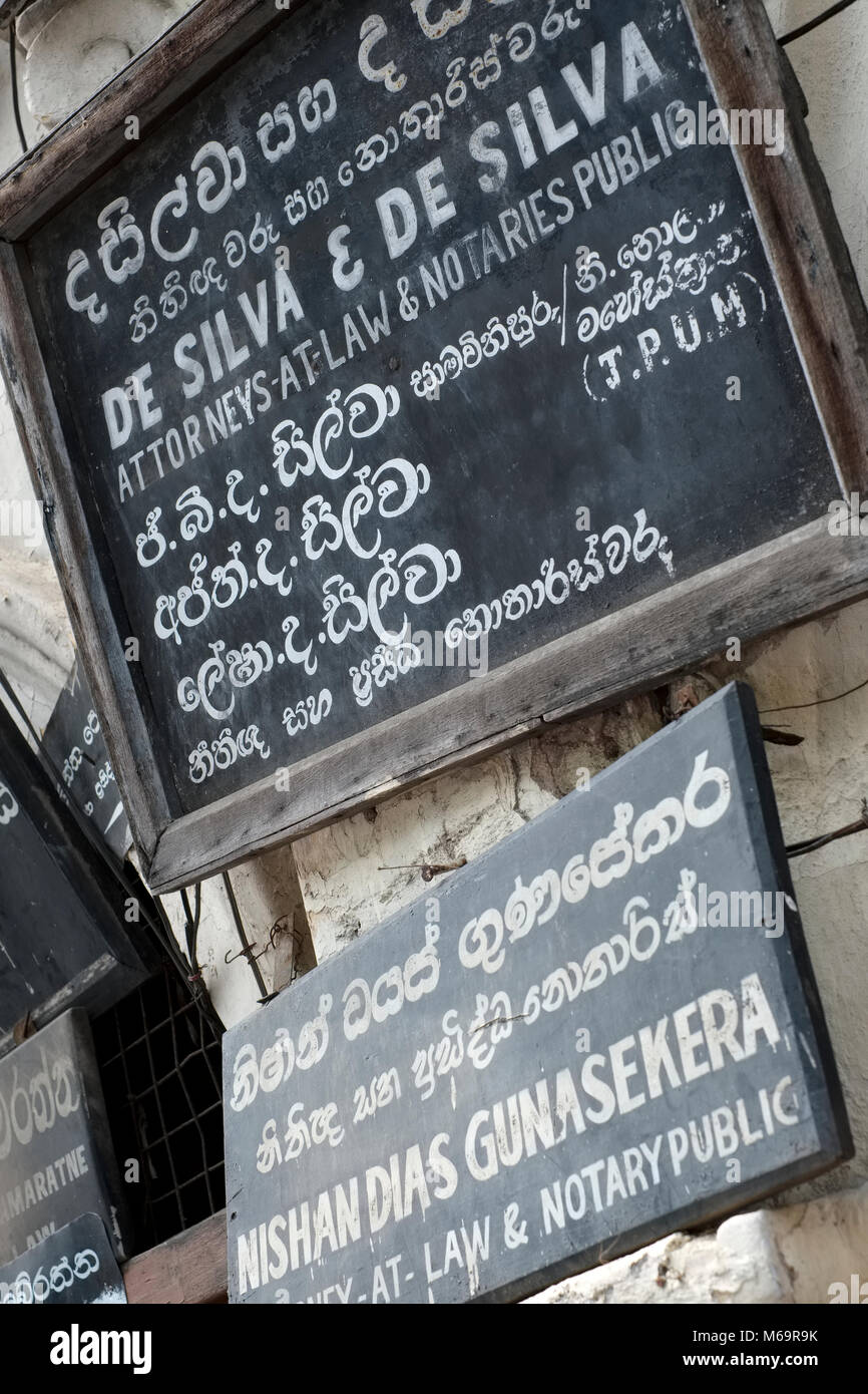 Signs for lawyers and advocates on a doorway in the city of Kandy in Sri Lanka Stock Photo