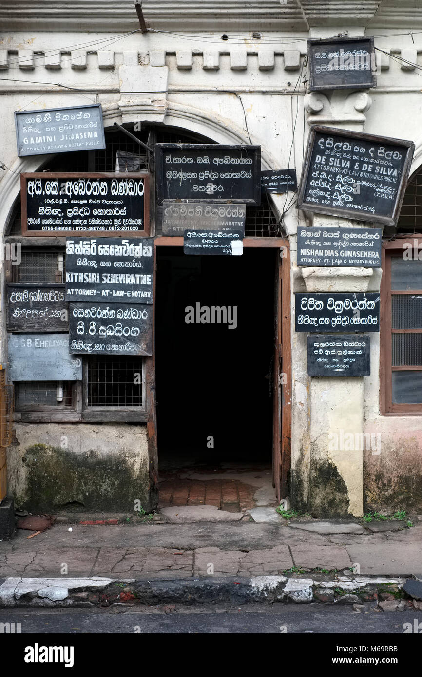Signs for lawyers and advocates on a doorway in the city of Kandy in Sri Lanka Stock Photo