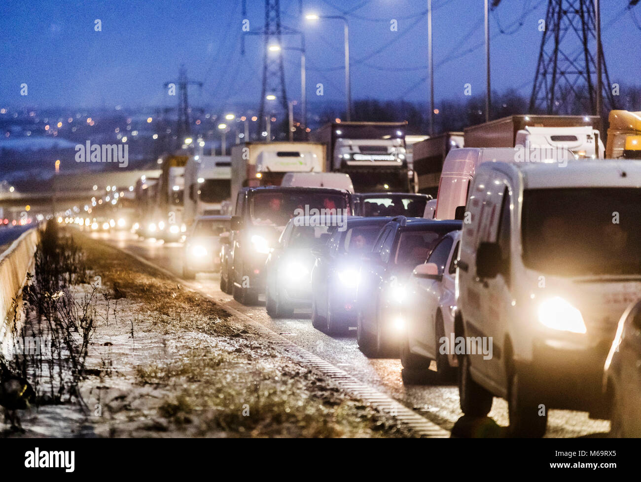 Traffic queueing to leave the M62 motorway ahead of junction 24 after the road was closed between junctions 21 and 24 as extreme weather continued to wreak havoc. Stock Photo