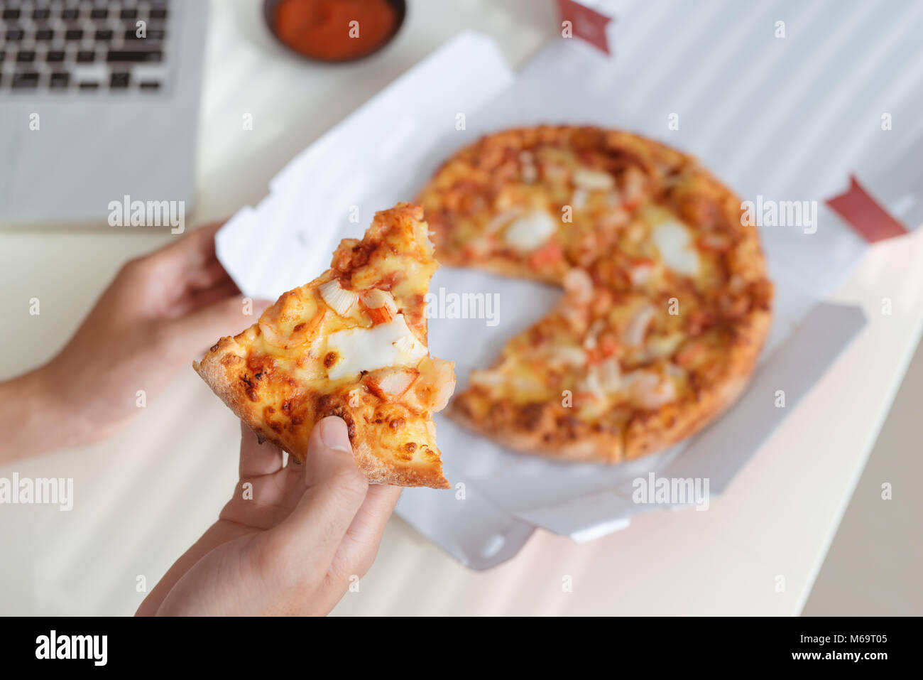 Office eating pizza slice desk hi-res stock photography and images - Alamy