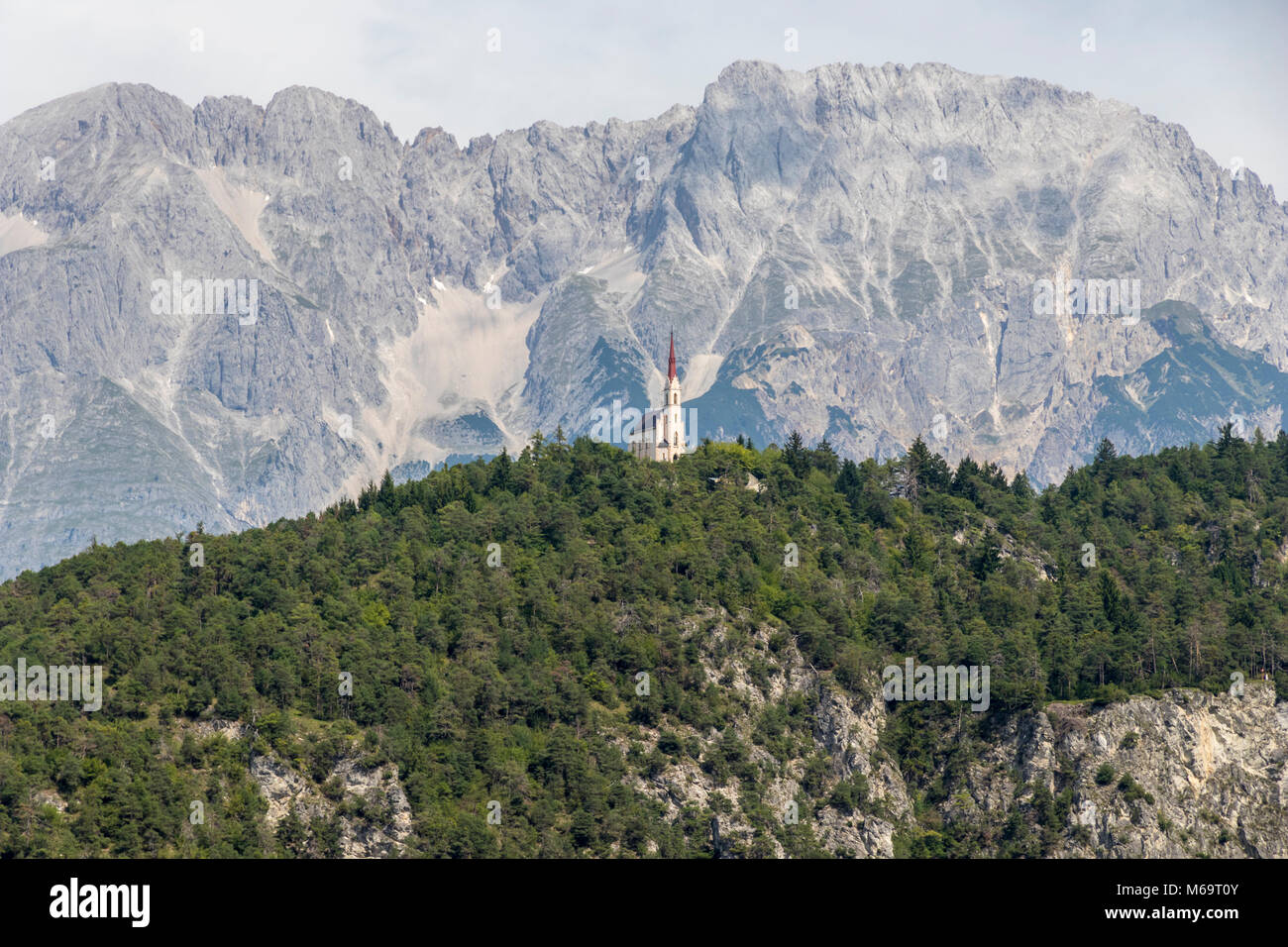 Church on a hill in the Austrian Camino the Santiago (Way of St James), near the towns of Mötz and Stams, State of Tyrol, Austria Stock Photo