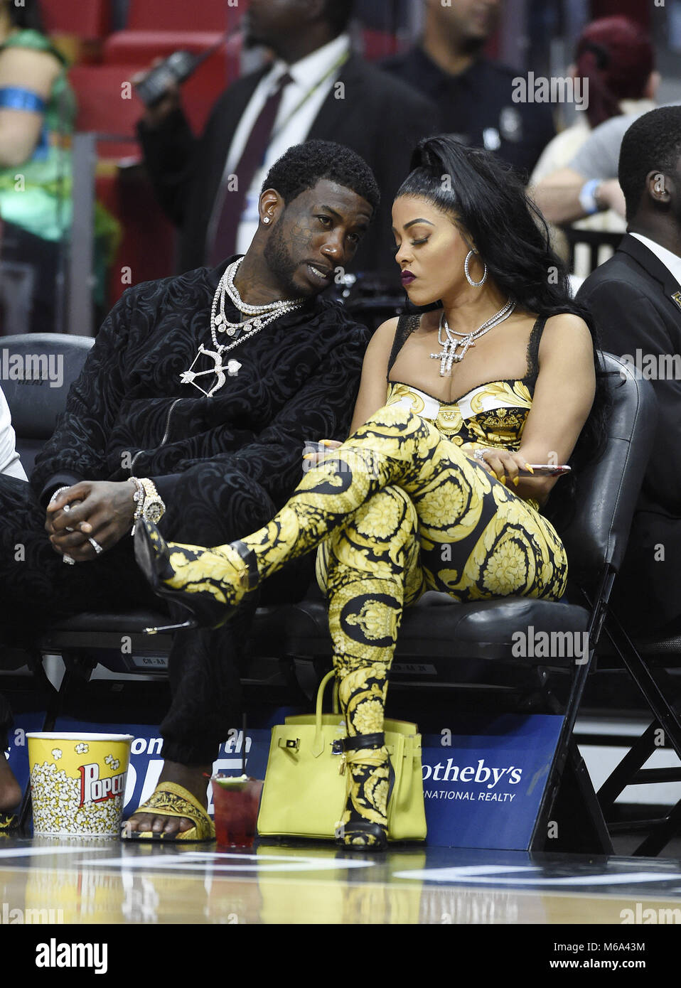 Miami, FL, USA. 01st Mar, 2018. Rapper Gucci Mane and his wife Keyshia  Ka'Oir watch the Los Angeles Lakers against the Miami Heat NBA game at the  AmericanAirlines Arena on March 1,