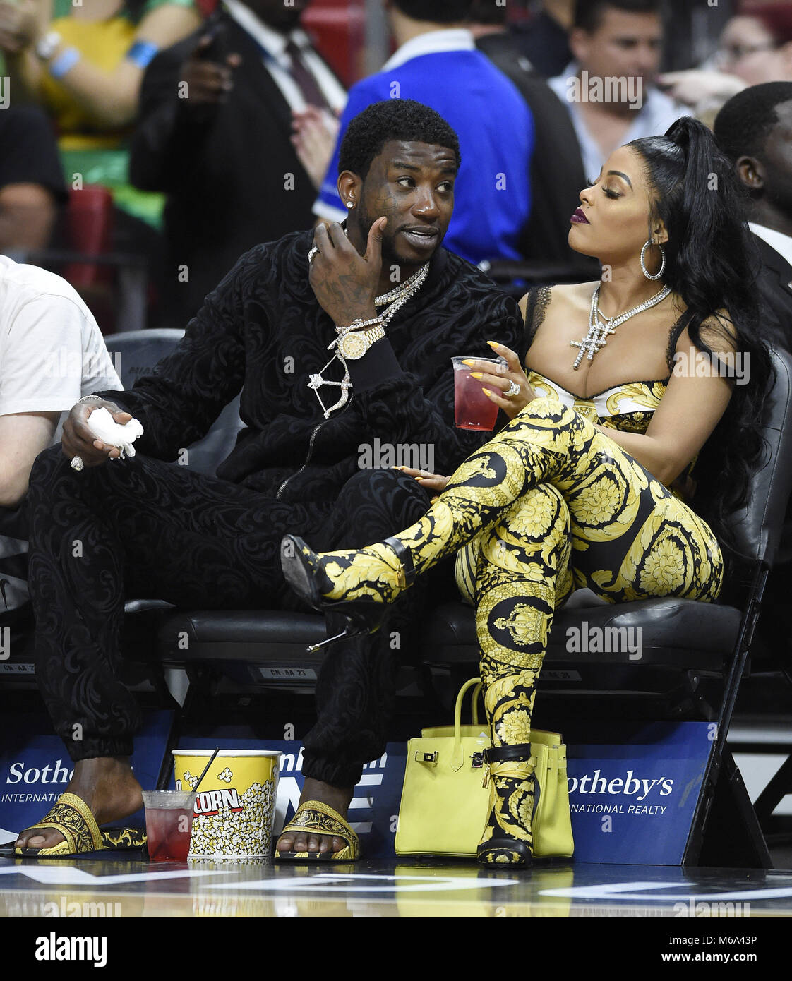 Miami, FL, USA. 01st Mar, 2018. Rapper Gucci Mane and his wife Keyshia  Ka'Oir watch the Los Angeles Lakers against the Miami Heat NBA game at the  AmericanAirlines Arena on March 1,