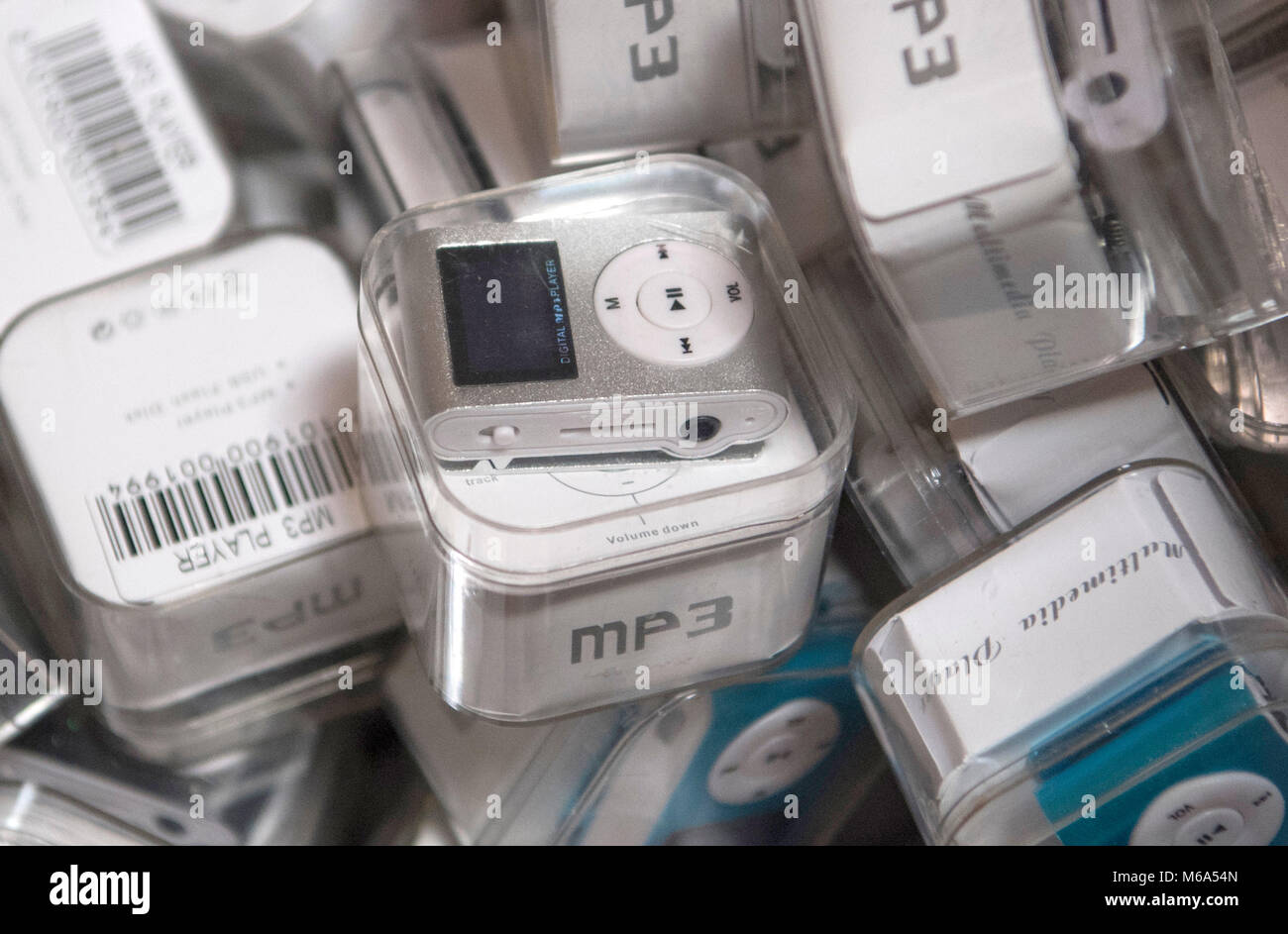 28 February 2018, Germany, Frankfurt: German customs seized fake MP3 players at a secret shipping's storage at an industrial estate. In the course of police investigations customs investigators stumbled upon a company that imported huge amounts of phone cases, chargers, batteries, MP3 players and headphones of China's two leading brand manufacturers. Photo: Boris Roessler/dpa Stock Photo