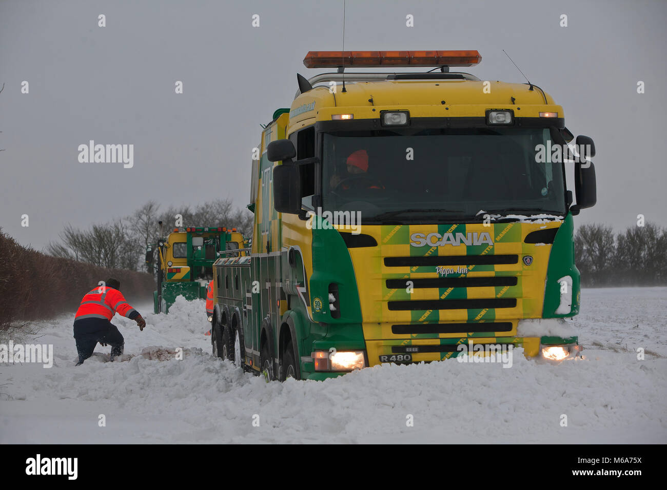 Steeple Bumpstead, Essex. 2nd Mar, 2018. UK Weather: Many roads were still un-passable today due to severe snowdrifts in Steeple Bumpstead Essex 01/03/2018 Please credit  : George Impey Who's rescuiing the tow truck ? This truck and its driver was stranded trying to help out stricken motorists but was left red faced when having to be rescued by his own company Credit: George Impey/Alamy Live News Stock Photo