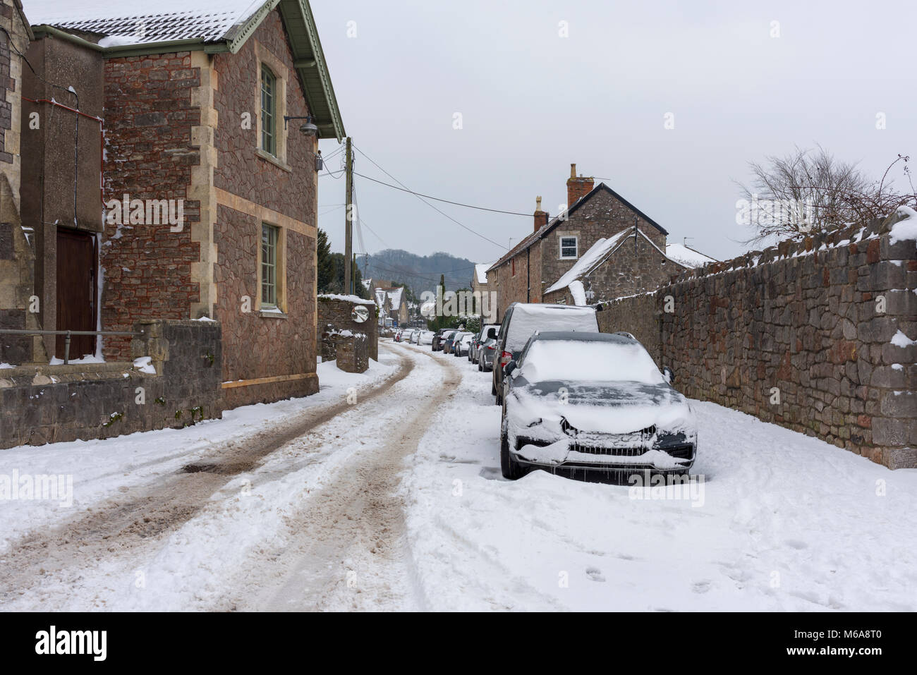 A street covered in snow in the rural village of Wrington, North Somerset, England. Stock Photo