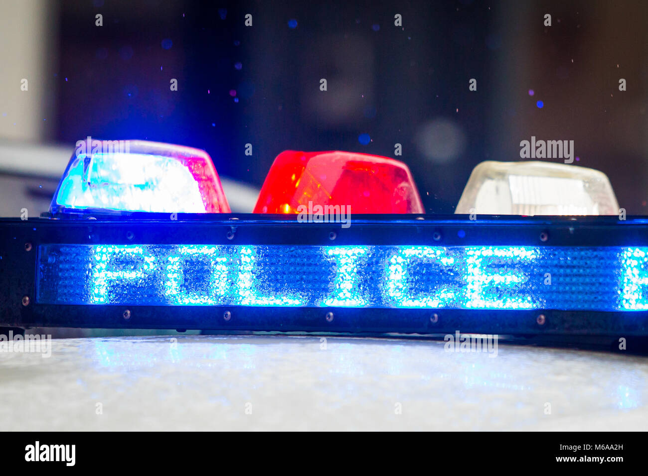 Police emergency lights with warning text close up display Stock Photo