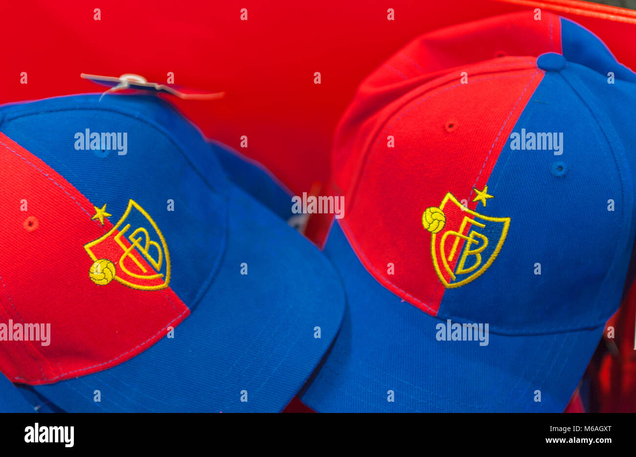 Caps with emblem on sale in the fans hop of FC Basel Stock Photo - Alamy