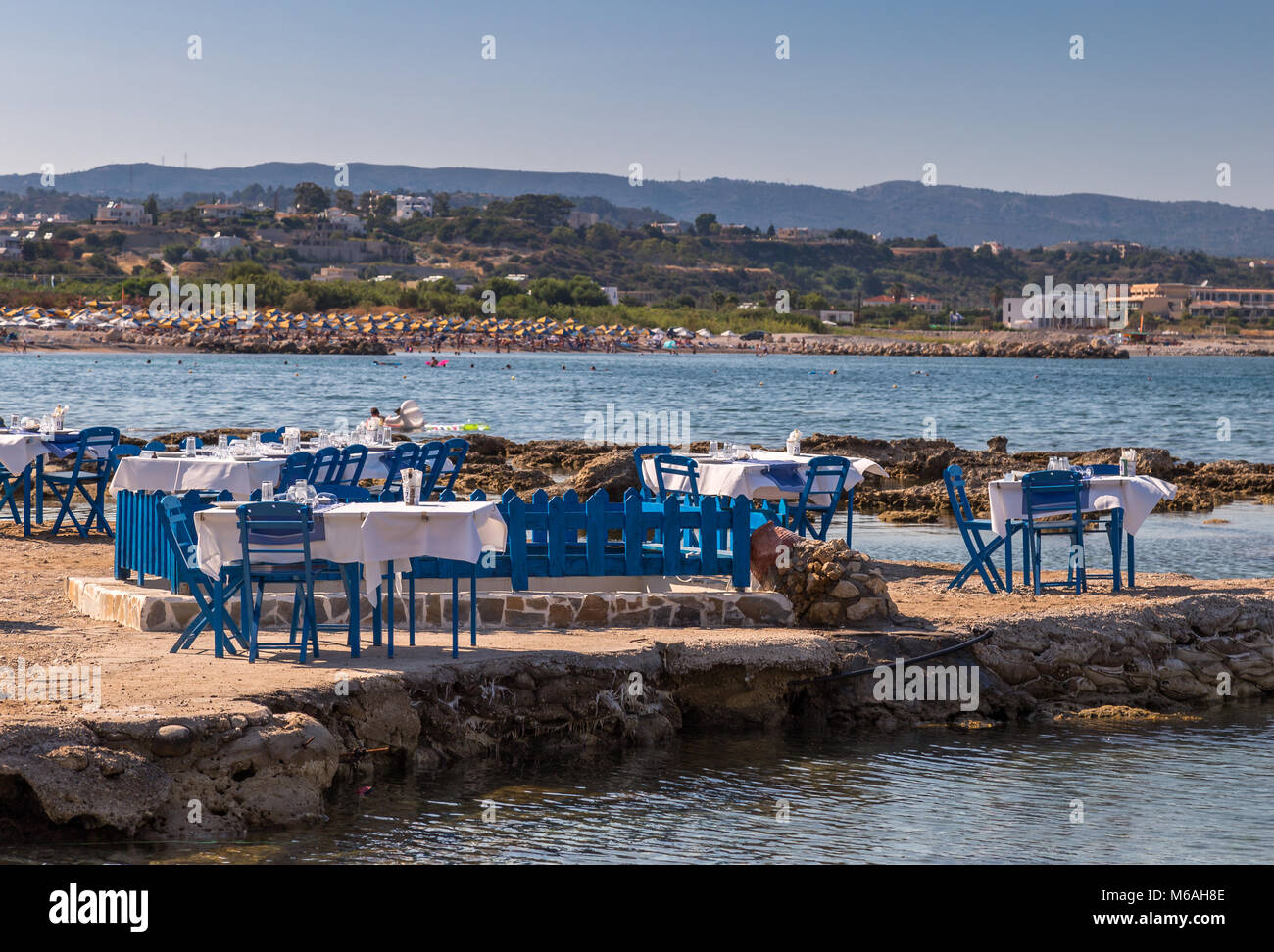 Seaside restaurant in the bay of Kolymbia, Rhodes Stock Photo
