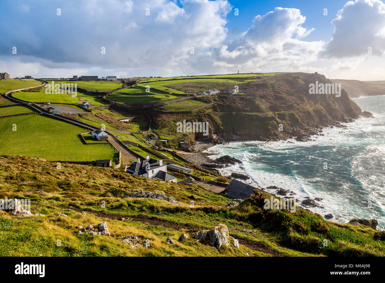 Looking south from the summit of Cape Cornwall towards the derelict cliff-side remains of a former Cornish tin mine, England, UK Stock Photo