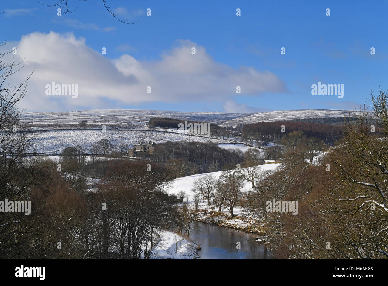 river wharfe flowing by 15th century barden tower in wintertime wharfedale yorkshire dales uk Stock Photo