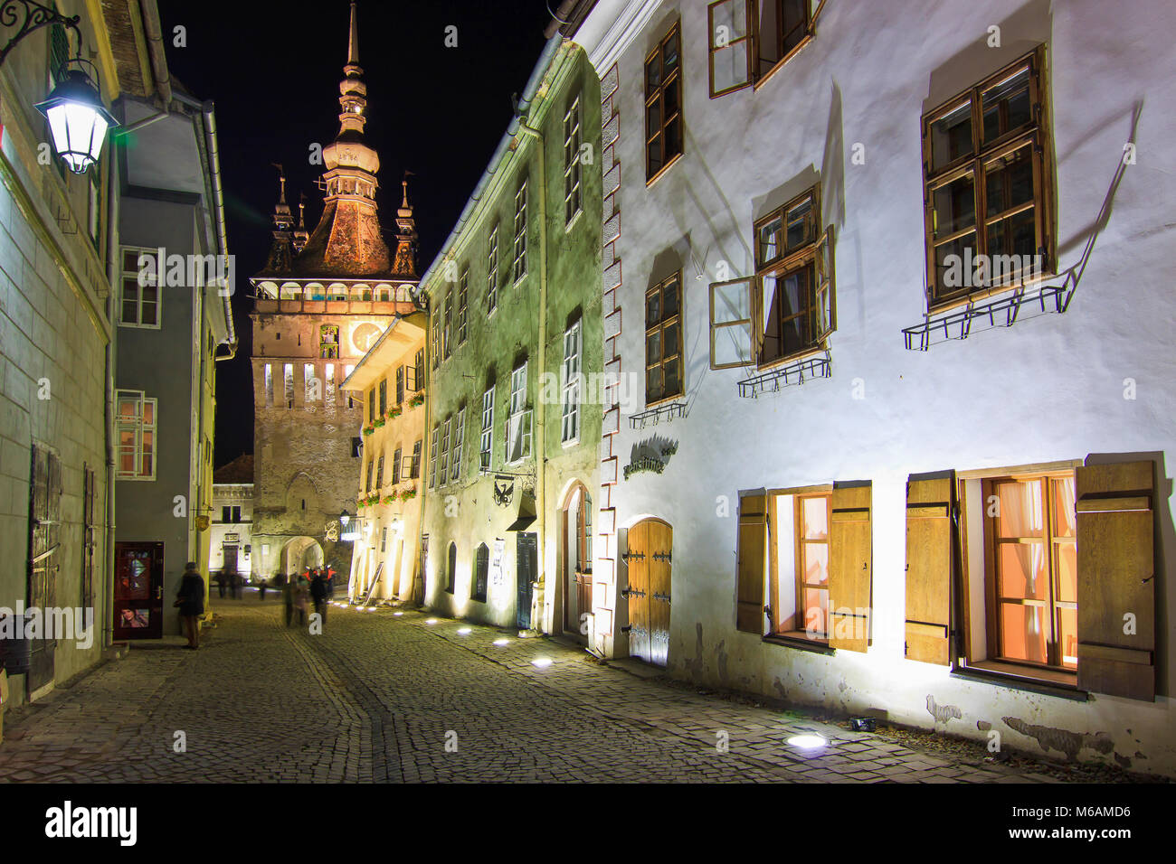 Sighisoara, Transylvania, Romania, 2012: Colorful houses in the old walled town center. Traditional architecture. Night view. Stock Photo
