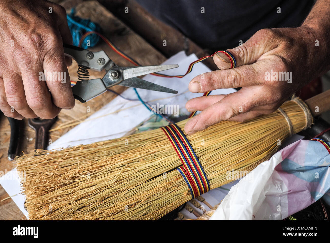 Traditional broom maker in the saxon village of Altana, Sibiu, Romania making tradition in saxon village of Altana, Sibiu, Romania Stock Photo
