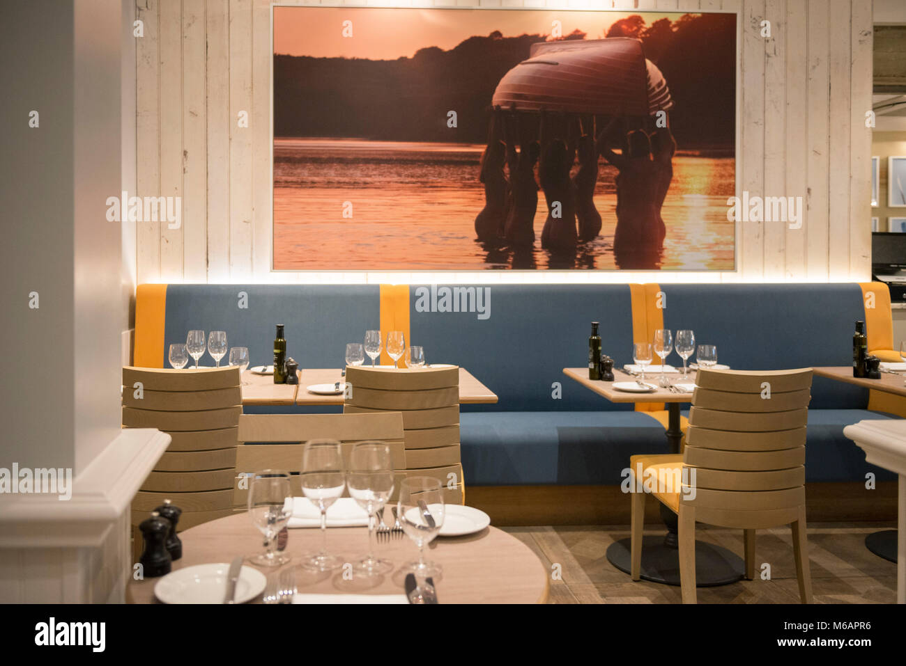 a table is laid out in a fine dining restaurant  ready to eat Stock Photo