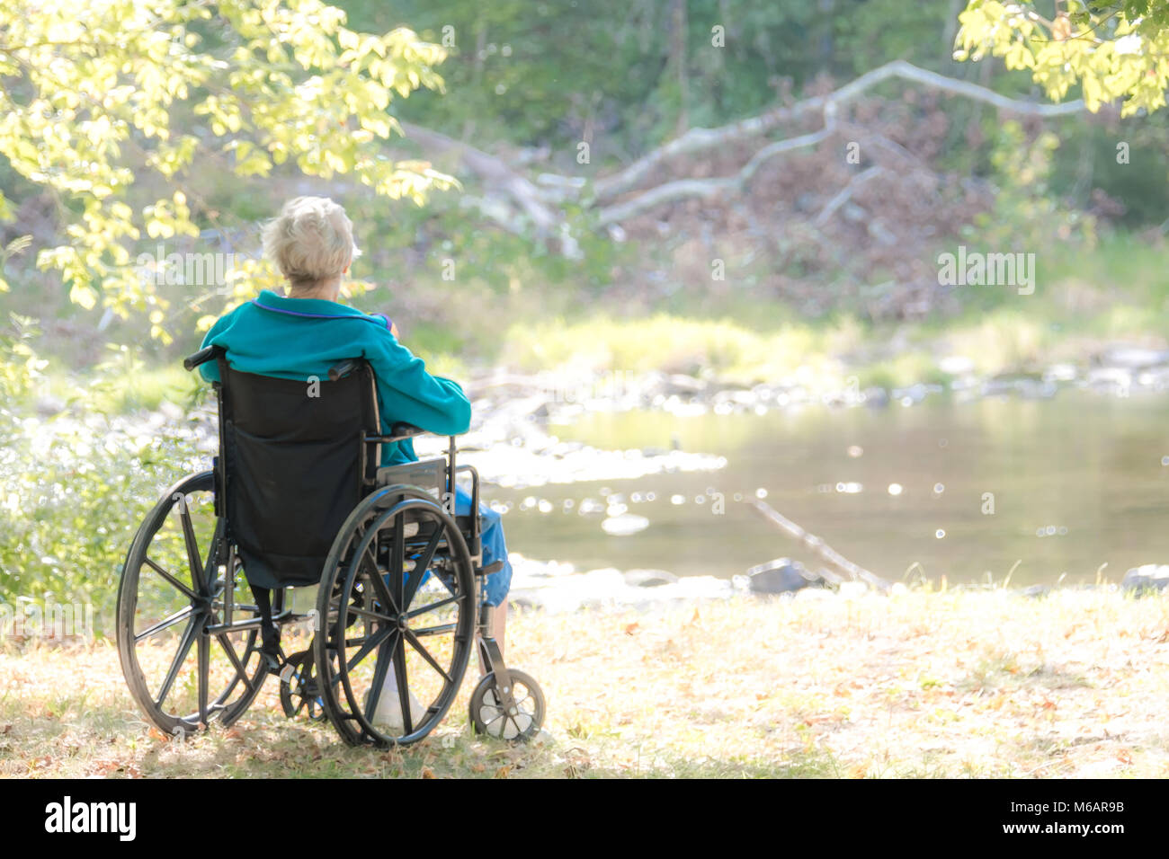 Woman on a wheelchair Stock Photo