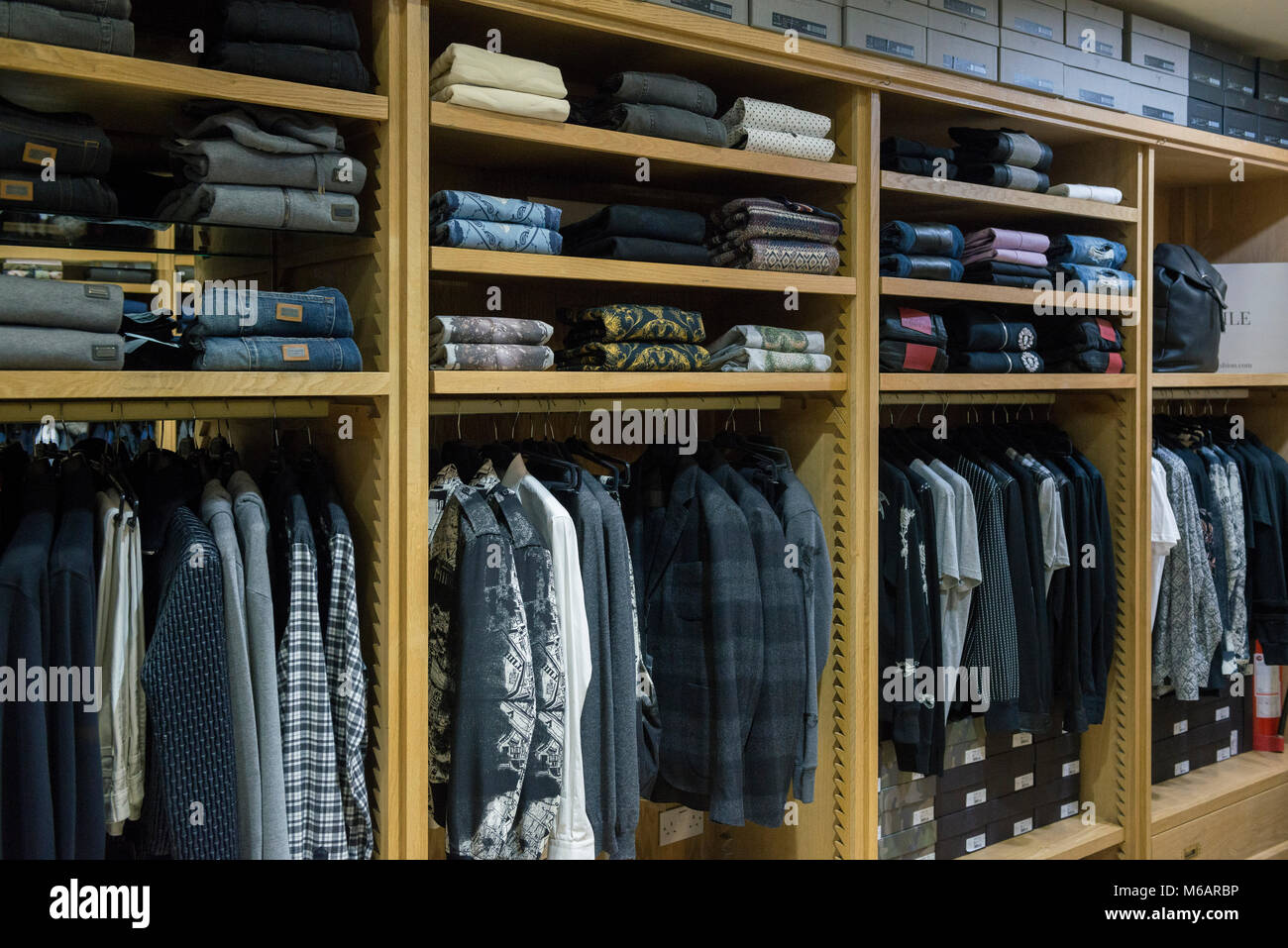 interior details of a small business shop selling mens fashion clothes and accessories. Stock Photo