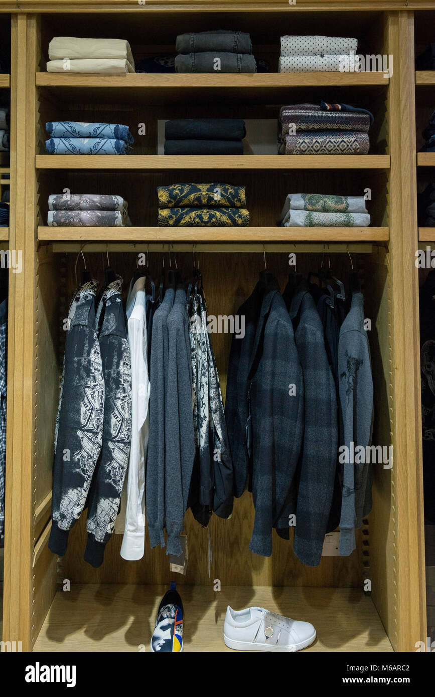 interior details of a small business shop selling mens fashion clothes and accessories. Stock Photo
