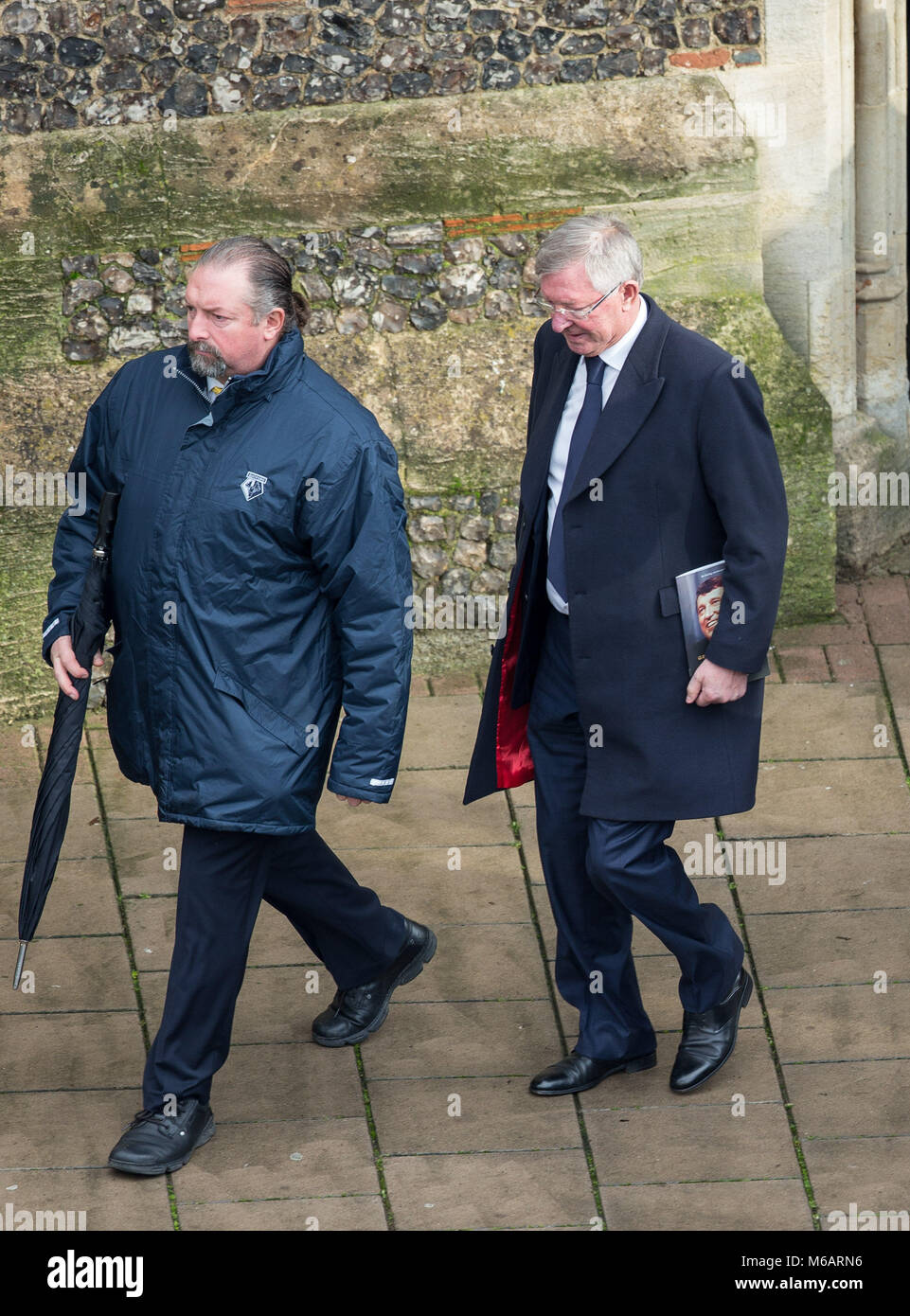 Sir Alex Ferguson is escorted to his car after the Funeral of Graham ...