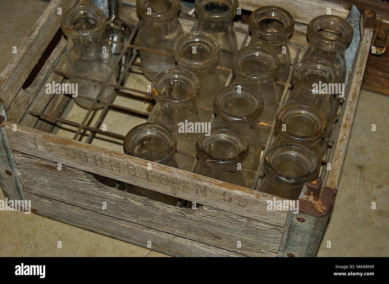 Antique milk bottles in a wooden crate Stock Photo Alamy