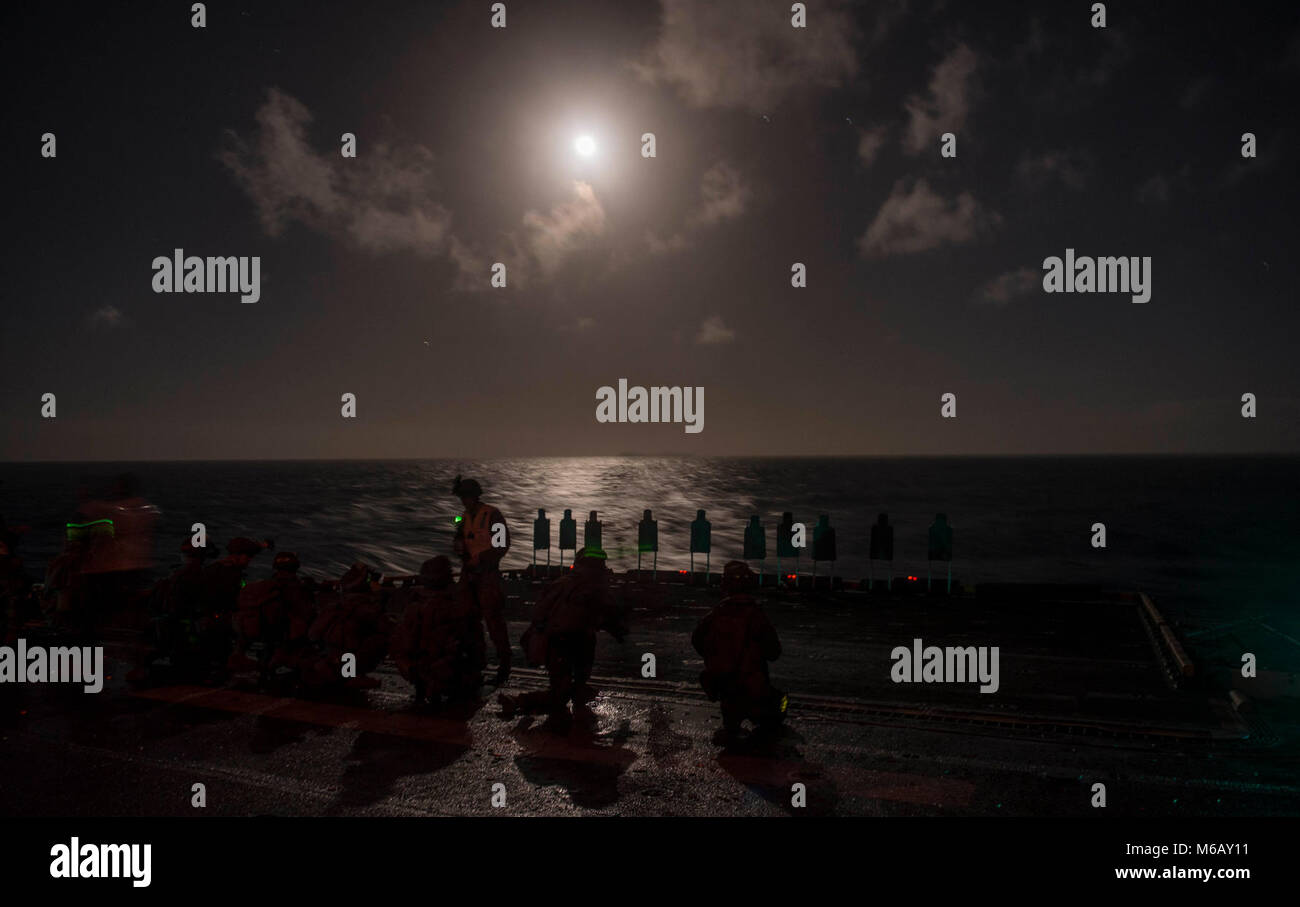 ATLANTIC OCEAN (Feb. 27, 2018) Marines assigned to Battalion Landing Team, 2nd Battalion, 6th Marine Regiment, 26th Marine Expeditionary Unit (MEU), wait for instruction during a live-fire exercise on the flight deck of the Wasp-class amphibious assault ship USS Iwo Jima (LHD 7), Feb. 27, 2018. Iwo Jima, homeported in Mayport, Florida, and the 26th MEU are conducting naval operations in the U.S. 6th Fleet area of operations.  (U.S. Navy Stock Photo