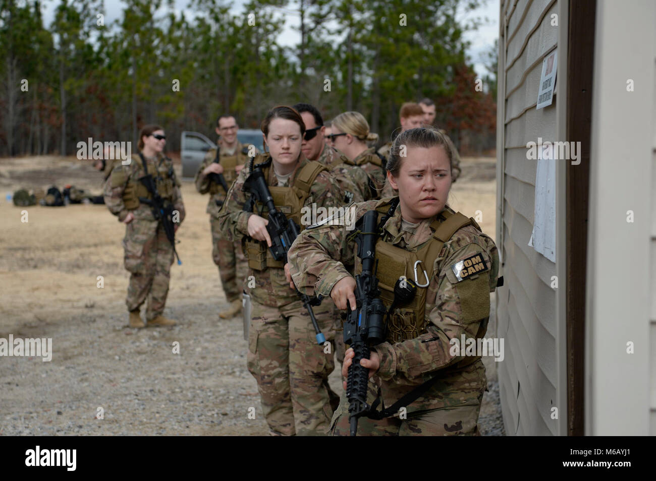 U.S. Air Force Airmen assigned to the 1st and 4th Combat Camera Squadrons train for close quarters battle and sensitive site exploitation during Exercise Scorpion Lens 2018, Feb, 11, 2018, at Fort Jackson, South Carolina. Exercise Scorpion Lens is an annual Ability to Survive and Operate training exercise mandated by Air Force Combat Camera job qualification standards. Held at the United States Army Training Center Fort Jackson, S.C., and the McCrady Training Center, Eastover, S.C., the exercise's purpose is to provide refresher training to combat camera personnel. Individuals are instructed i Stock Photo