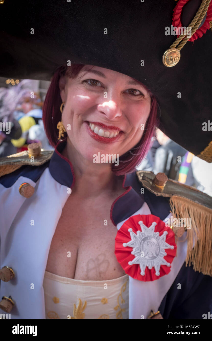 Costumed reveler participating in the Krewe of Cork Mardi Gras parade.  French Quarter, New Orleans, Louisiana, USA Stock Photo