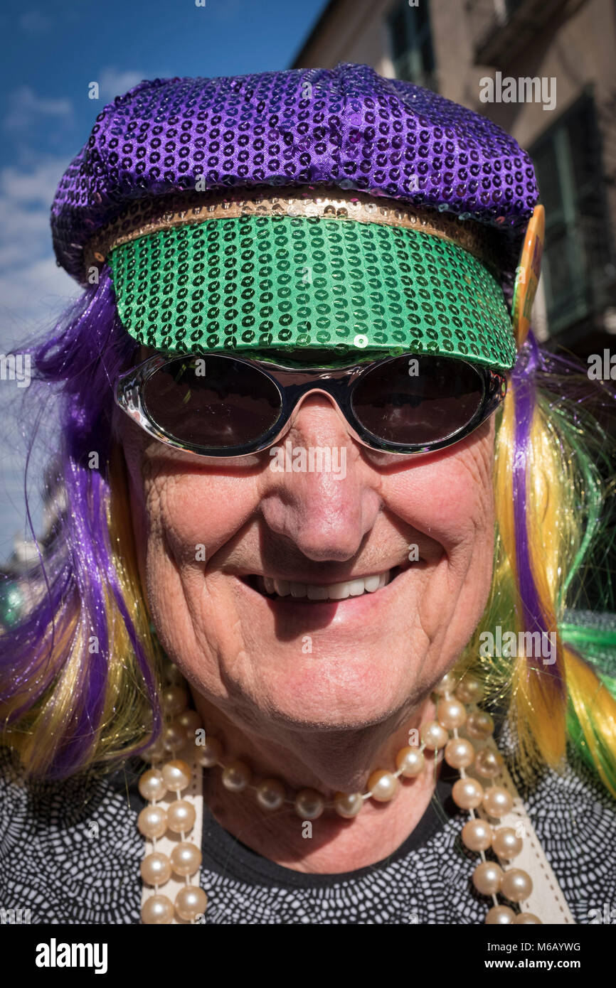 Costumed reveler participating in the Krewe of Cork Mardi Gras parade.  French Quarter, New Orleans, Louisiana, USA Stock Photo