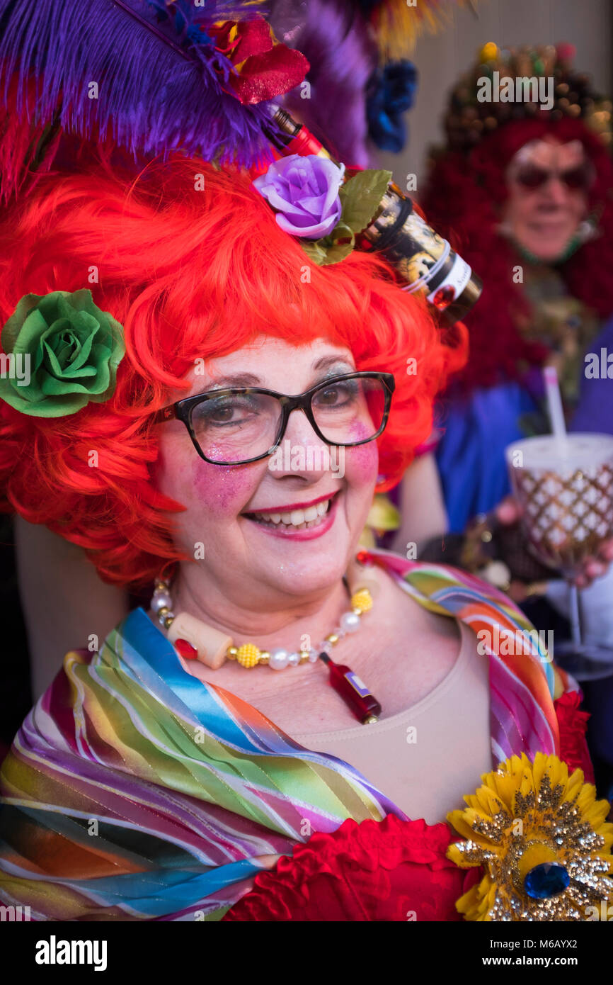 Costumed reveler participating in the Krewe of Cork Mardi Gras parade.  French Quarter, New Orleans, Louisiana, USA Stock Photo