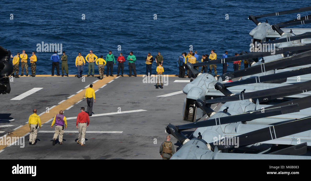 ATLANTIC OCEAN (Feb. 24, 2018) Sailors search for foreign object debris on the flight deck of the Wasp-class amphibious assault ship USS Iwo Jima (LHD 7). Iwo Jima, homeported in Mayport, Fla., is conducting naval operations in the U.S. 6th Fleet area of operations.  (U.S. Navy Stock Photo