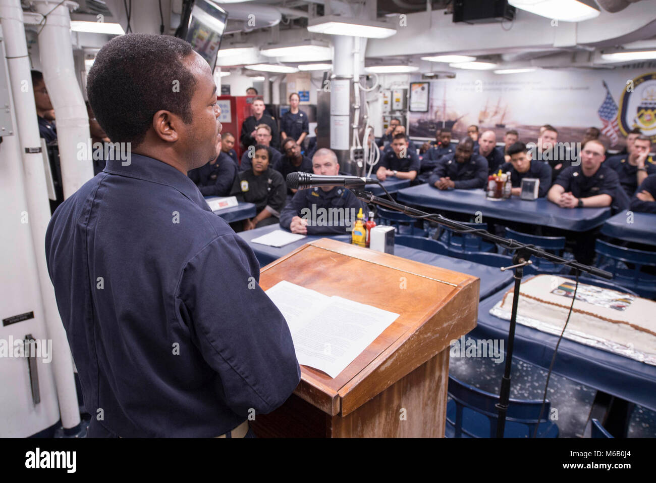 PACIFIC OCEAN (Feb. 25, 2018) Chief Operations Specialist Marico Myhand, from Brundidge, Ala., gives a speech during the African American/Black History Month celebration on the mess decks of the Arleigh Burke-class guided-missile destroyer USS Dewey (DDG 105). Dewey is operating in the Indo-Pacific region to enhance interoperability with partners and serve as a ready-response force for any type of contingency.  (U.S. Navy Stock Photo